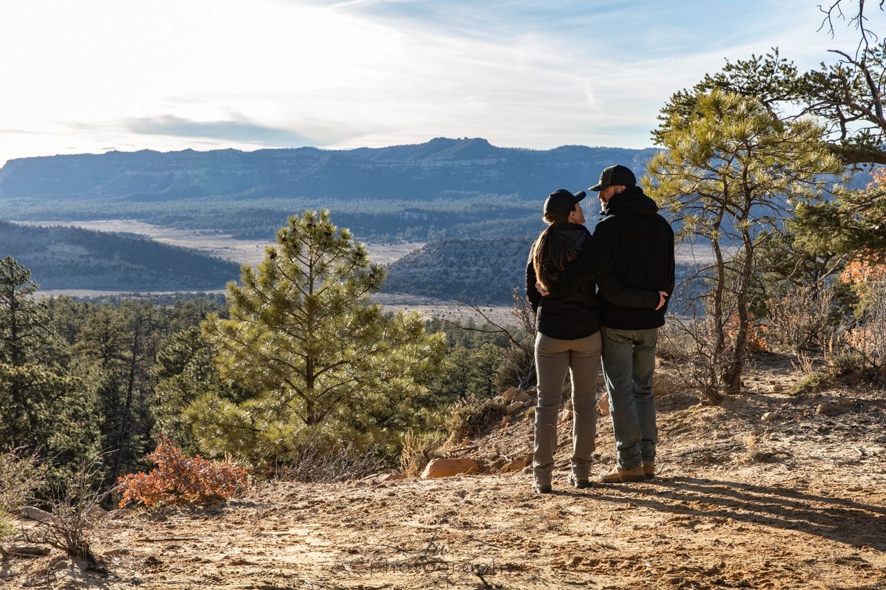 Olivia Jacobs and Pat Kaiser overlooking the New Mexico mountains at sunset