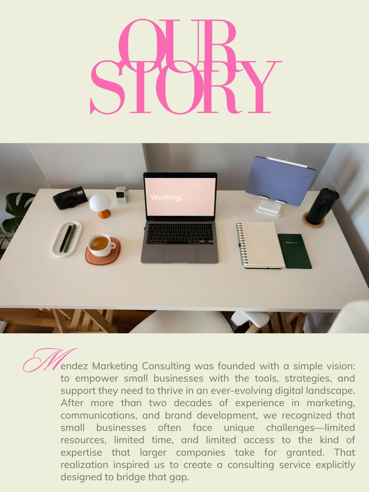 A neatly organized workspace with a laptop displaying 'Working.' and marketing consulting story text.
