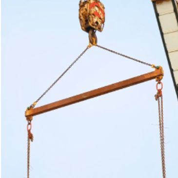 Crane hook lifting a metal beam.