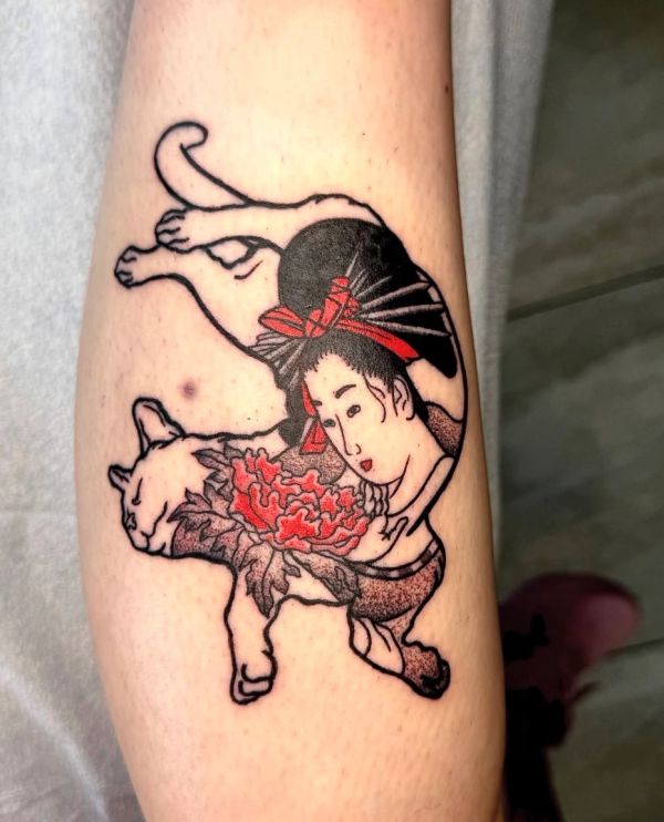 Tattoo of a woman and a cat intertwined with floral elements.