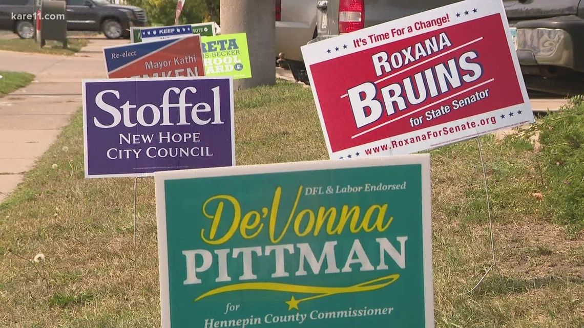 Yard signs for local political candidates, including Stoffel for New Hope City Council, De'Vonna Pittman for Hennepin County Commissioner, and Roxana Bruins for State Senator, showcasing targeted advertising in community settings.