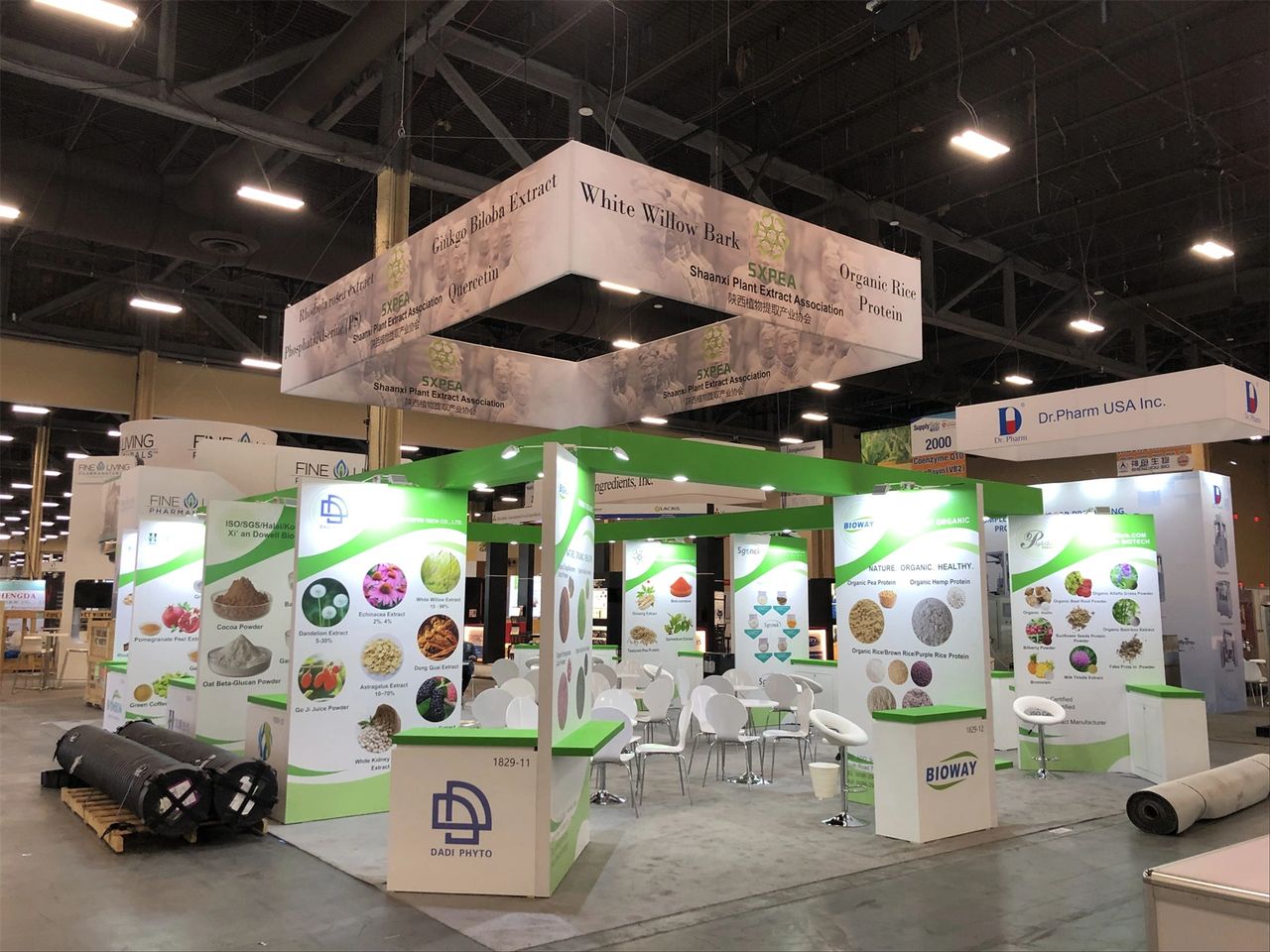 Trade show booth featuring interactive displays and product samples, showcasing ingredients like cocoa powder and organic proteins, emphasizing engagement and brand visibility for marketing success.