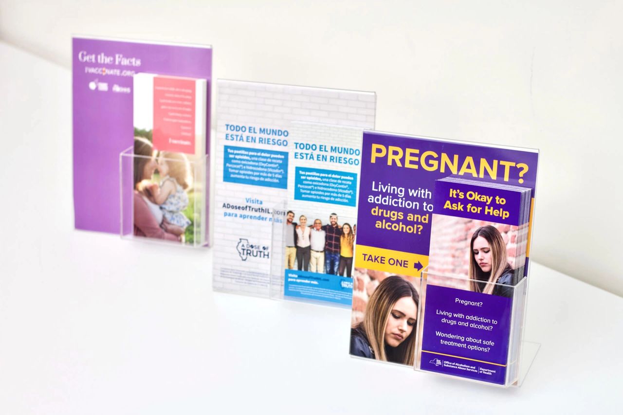 Brochure display in healthcare setting featuring informational materials on addiction, pregnancy, and resources for help, emphasizing digital advertising strategies in healthcare.