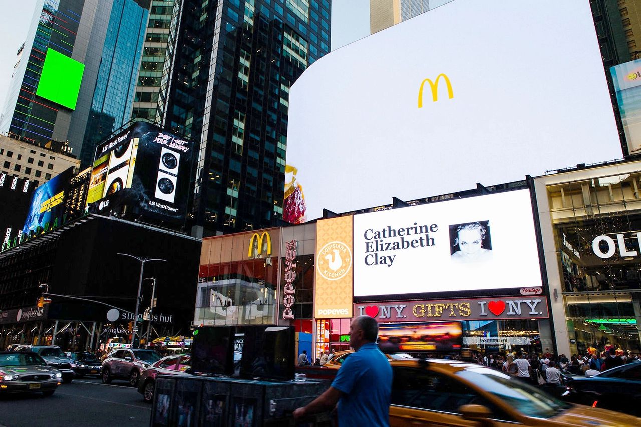 Billboards in Times Square featuring McDonald's and Popeyes, illustrating vibrant advertising opportunities for small businesses.