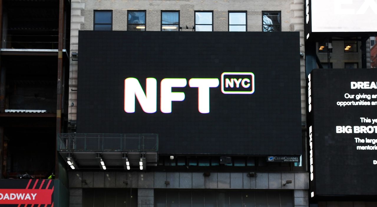 Digital billboard displaying "NFT NYC" in bold letters, highlighting location-based advertising potential and engaging local audiences.