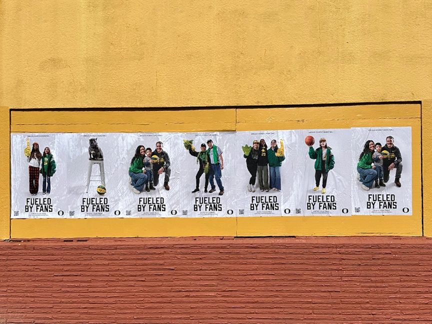 Posters featuring diverse groups of fans in Oregon, showcasing community spirit and engagement, with the slogan "Fueled by Fans" prominently displayed.