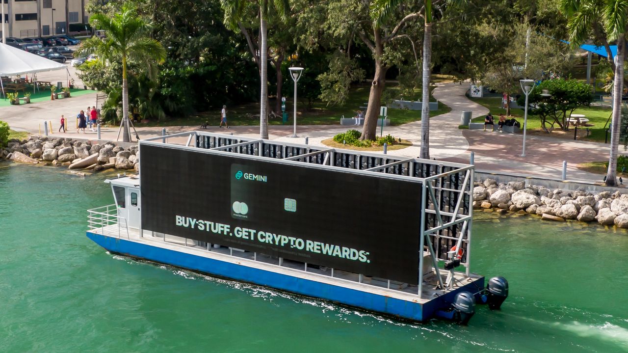 Identifying relevant influencers in your industry or niche is key to successful collaboration. Boat with large digital billboard displaying "BUY STUFF. GET CRYPTO REWARDS." in Miami, promoting innovative marketing activations and brand engagement strategies.