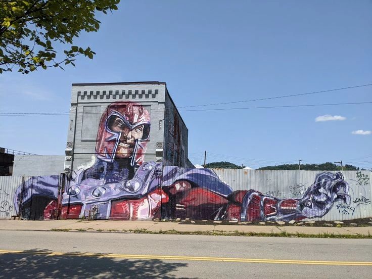 Mural of a superhero character, showcasing vibrant colors and intricate details, enhancing urban art scene in Utah, relevant to mural advertising and brand visibility.
