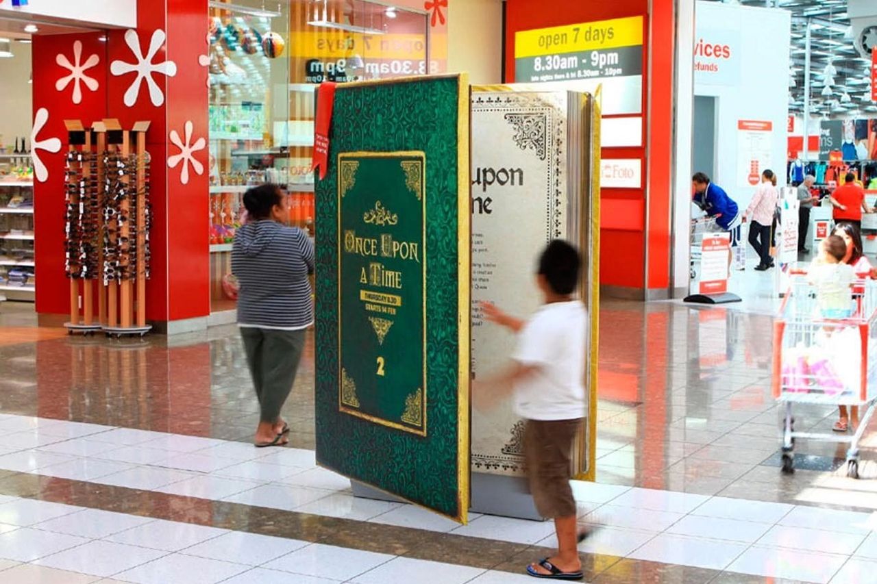Integration with Artificial Intelligence has revolutionized the field of mall advertising. Interactive book display in a shopping mall, featuring "Once Upon a Time" theme, engaging customers and enhancing advertising experience.