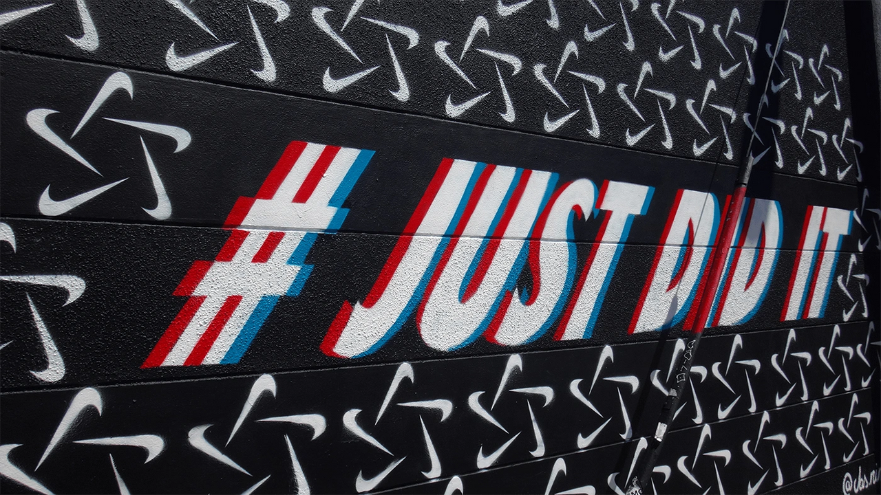 # Just Did It hashtag mural featuring Nike logos, emphasizing audience engagement and brand visibility in social media campaigns.
