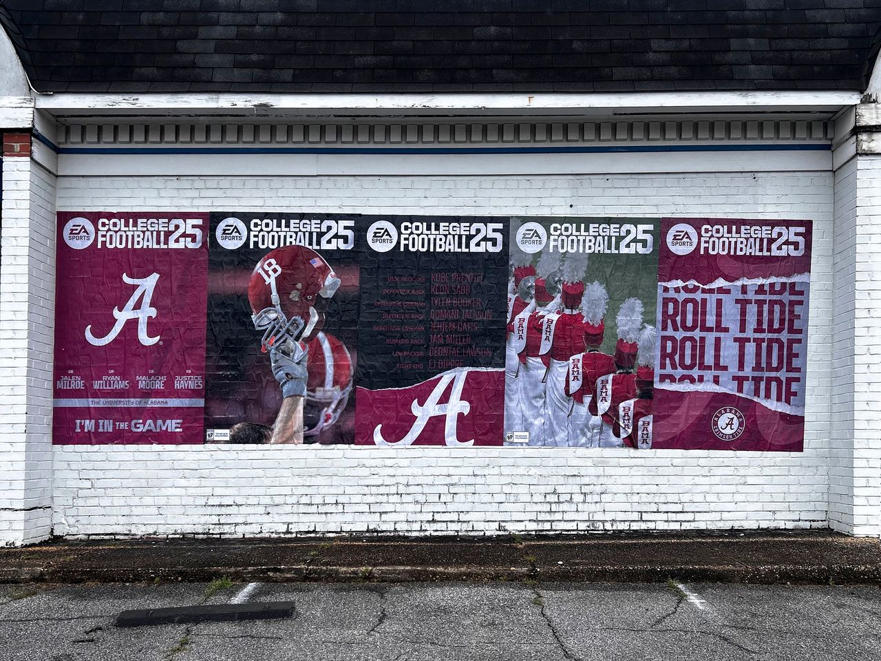 Vibrant wall mural promoting Alabama football, featuring players and "Roll Tide" slogan, part of guerrilla marketing campaign in urban Alabama.