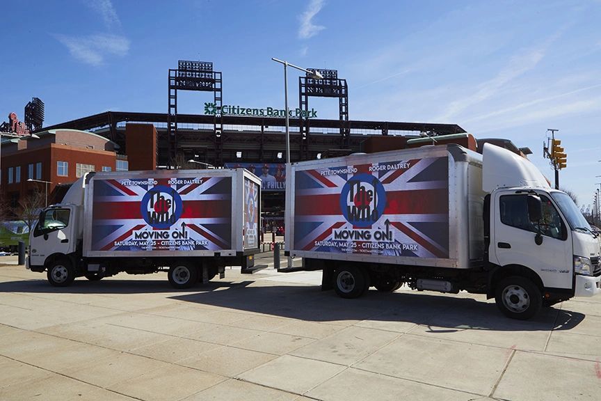 LED Billboard Trucks in Philadelphia for The Who Reunion Tour, PA LED billboard trucks advertising The Who's reunion tour outside Citizens Bank Park in Philadelphia, featuring British flag design and event details.