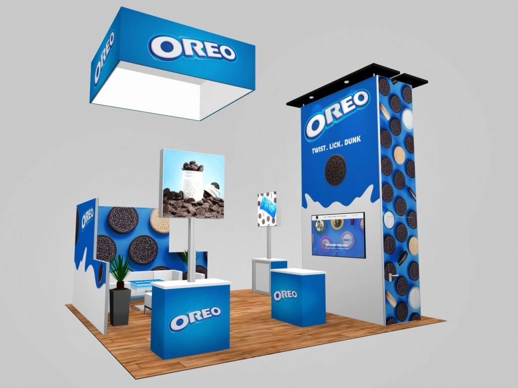 Oreo-themed tradeshow booth design featuring blue branding, interactive displays, and a welcoming layout, illustrating trends in exhibition marketing for 2024.