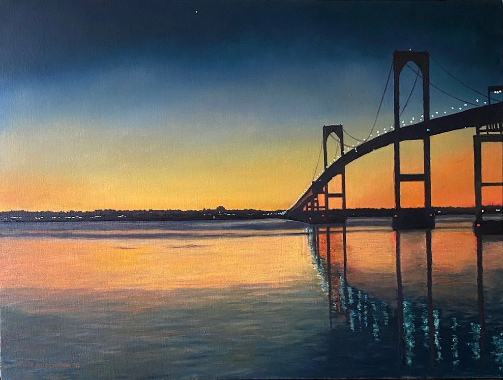 Bridge silhouette at sunset with colorful sky and water reflections.