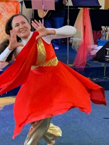 Woman wearing red dress and dancing