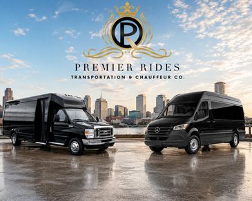 Two luxury black transportation vans with city skyline background.