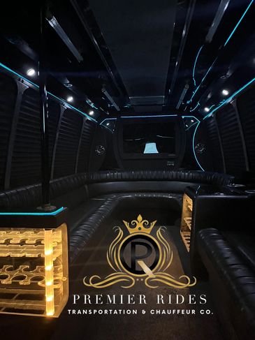 Luxury limousine interior with ambient lighting.