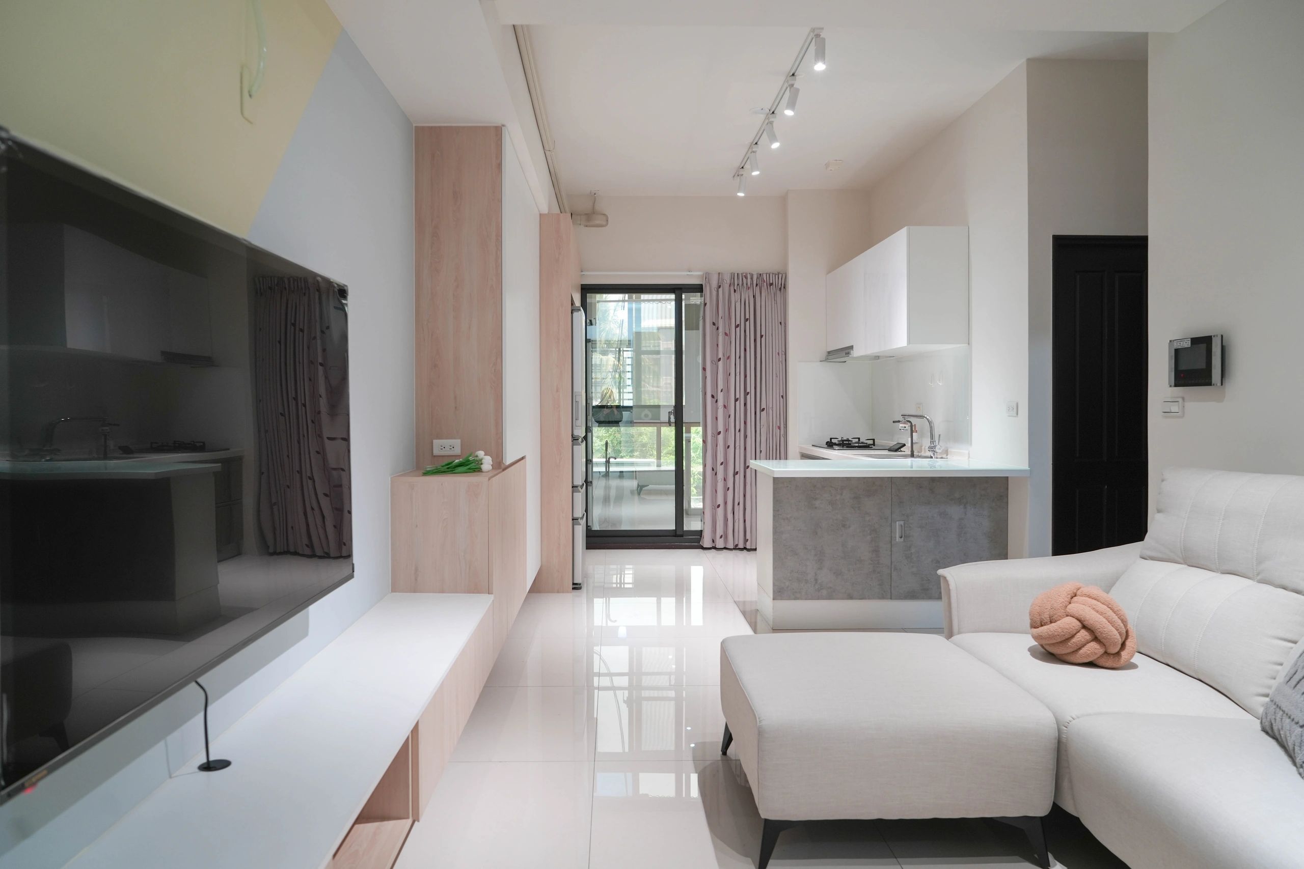 Modern minimalist living space with neutral tones and sleek design.