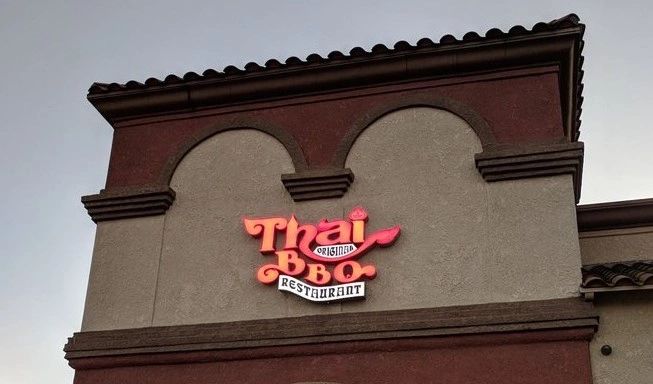 Thai BBQ logo on front of building
