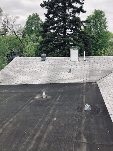 an flat roof and a shingle roof 