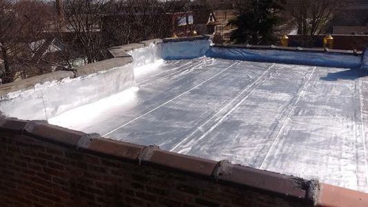 aluminum reflective coating on a flat roof 