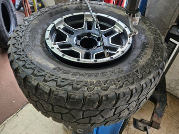 mud tire on a tire changer. Dismount Tire 