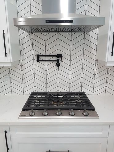 range hood and pot filler in custom build kitchen 