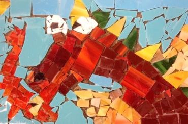 Colorful mosaic art depicting a dragon with red scales and yellow spikes.