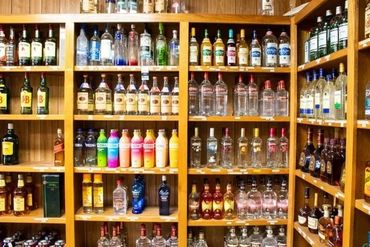 A Shelf With A Lot Of Bottles