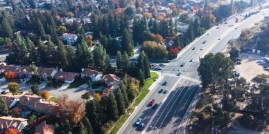 Aerial view of a suburban neighborhood with busy roads.