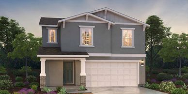 Modern two-story house with gray exterior and a double garage.