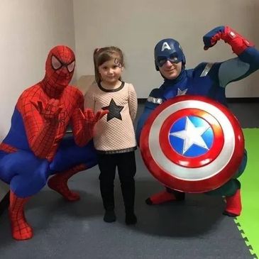 kid playing at super heros