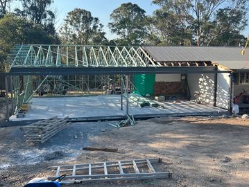 House construction with metal framing and concrete floor