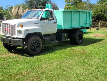 White Truck With 10-Yard Dumpster ready for rental.

