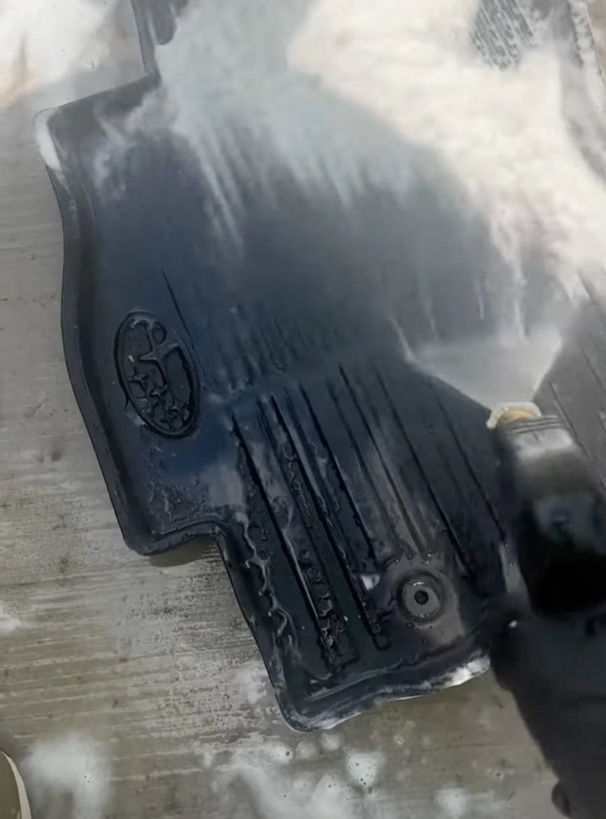 Car mat power wash and scrub