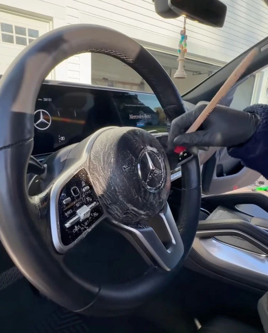 Agitating dust from dash crevices