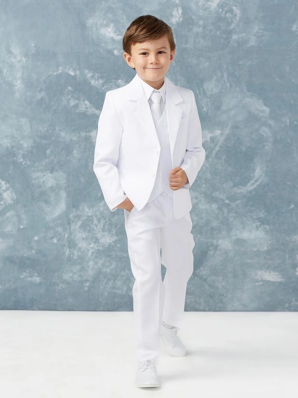 Young boy dressed in a formal white suit with a confident smile.