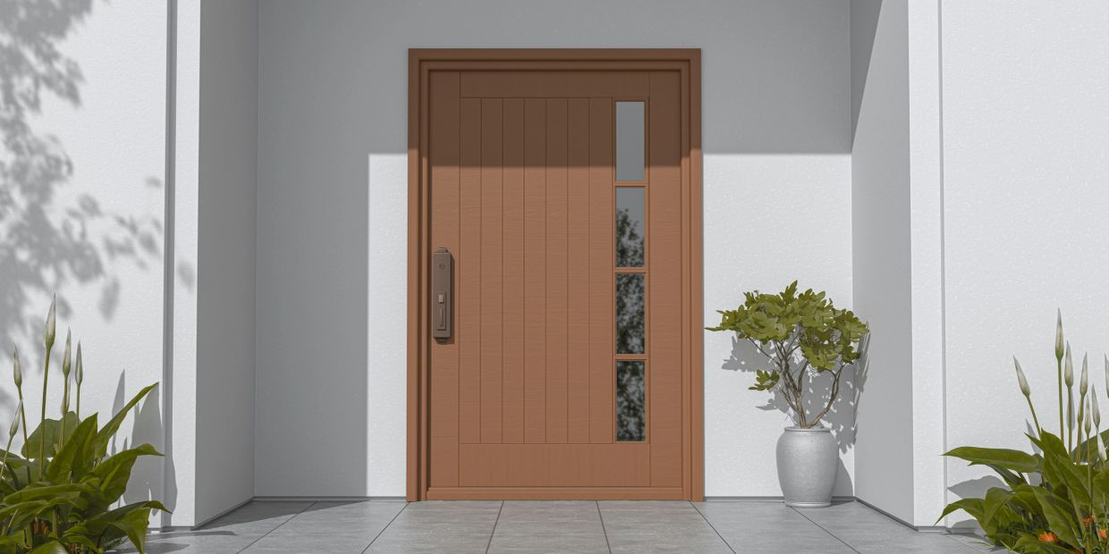 Modern brown front door with vertical glass panels and plants on each side.