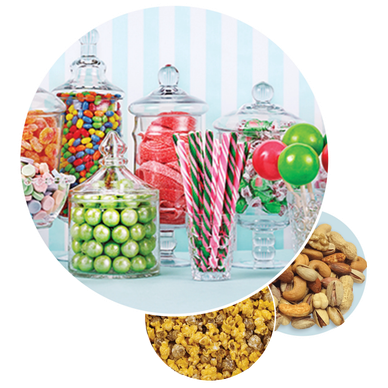 Colorful candy jars, mixed nuts, and popcorn in separate bowls.