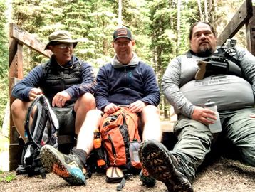 Forrest McKinnis hiking with friends at Maxwell Lake Trail in Lostine, Oregon.