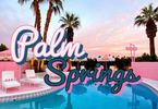 Located in Palm Springs, California a luxury pink pool with palm trees in the background