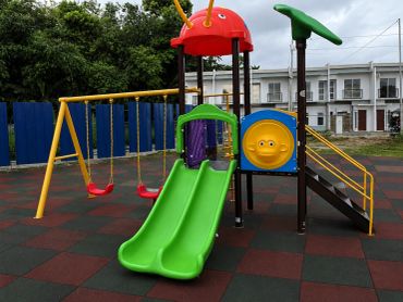 Colorful playground with slides and swings.