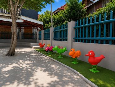 Colorful animal-shaped playground spring riders in a yard.