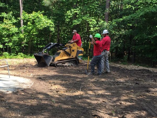 Crew members doing a grading project.