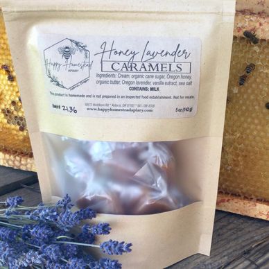 Packaged honey lavender caramels with lavender flowers and honeycomb.
