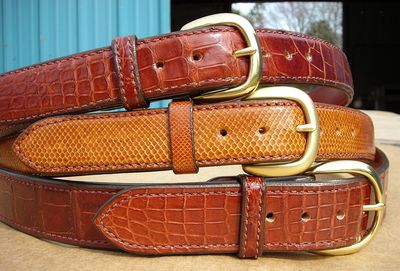 A view of domed gator, domed snake, flat gator leather belts
