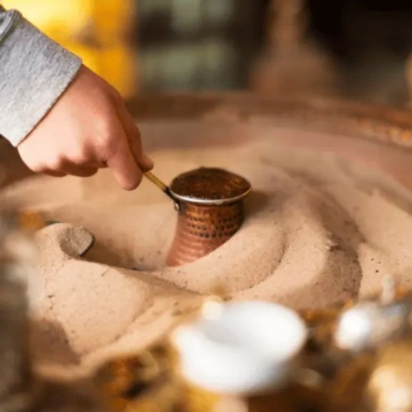 Turkish coffee brewed on hot sand is a traditional method of preparing Turkish coffee