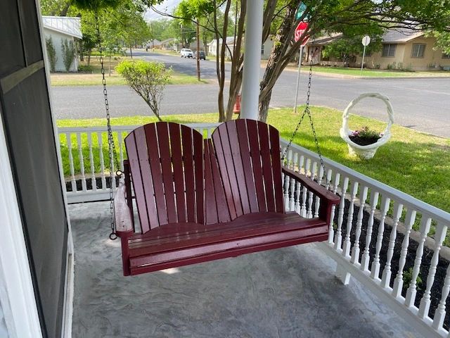 The red front porch for 2 is a perfect place to enjoy some wine and watch the world go by.