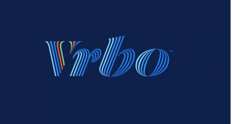 Vrbo logo with stylish blue stripes on a dark background.