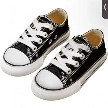 Black and white canvas sneakers with white laces.